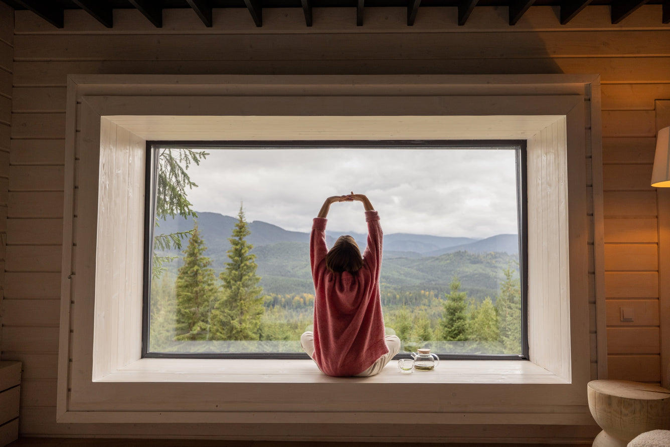 Woman sitting in window