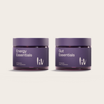 Two purple jars labeled 'Energy Essentials' and 'Gut Essentials' by liv on a light beige background.