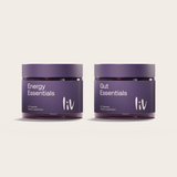 Two purple jars labeled 'Energy Essentials' and 'Gut Essentials' by liv on a light beige background.