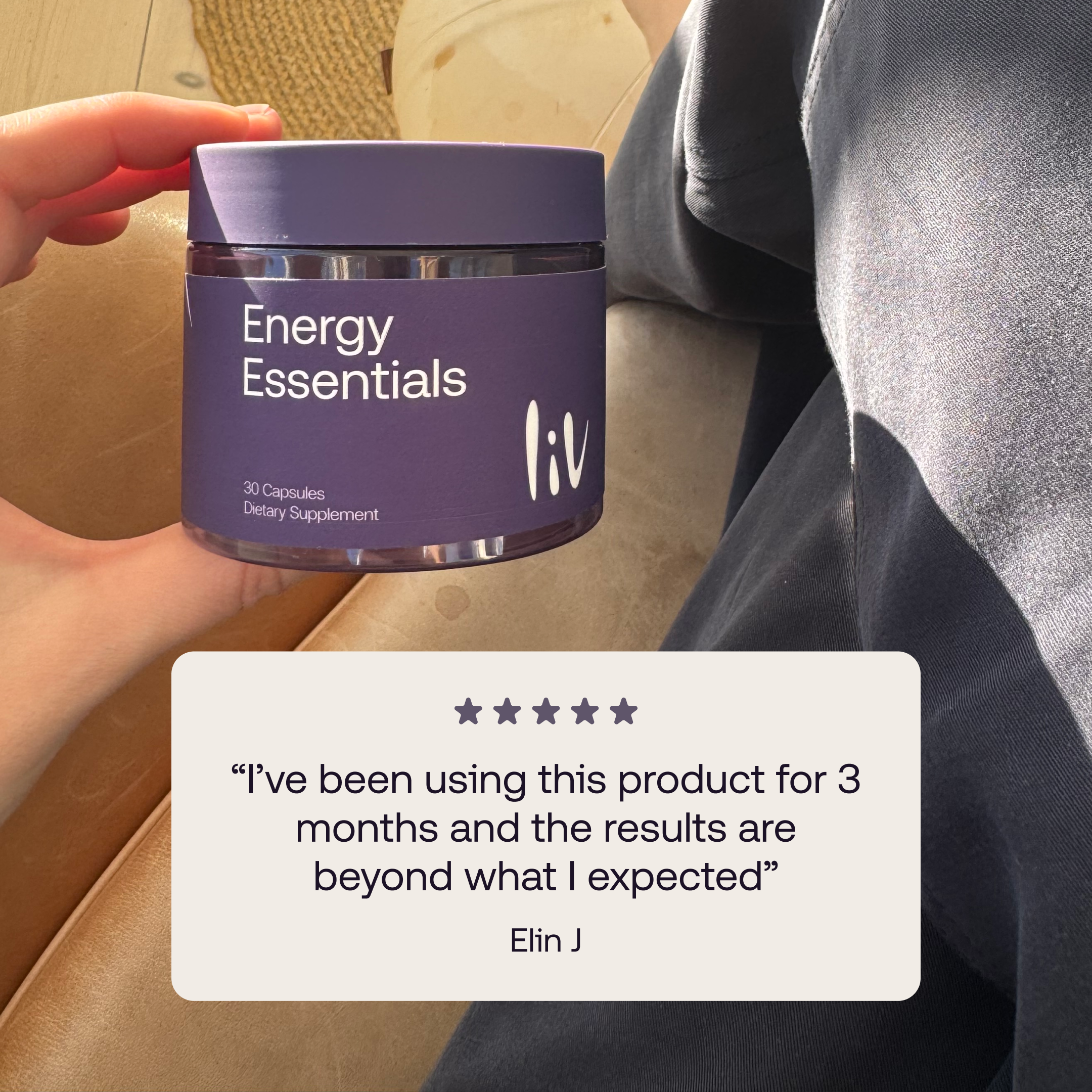 A hand holding an energy essentials supplement bottle. The quote says: Ive been using this product for 3 moths and the results are beyond what i expected. 