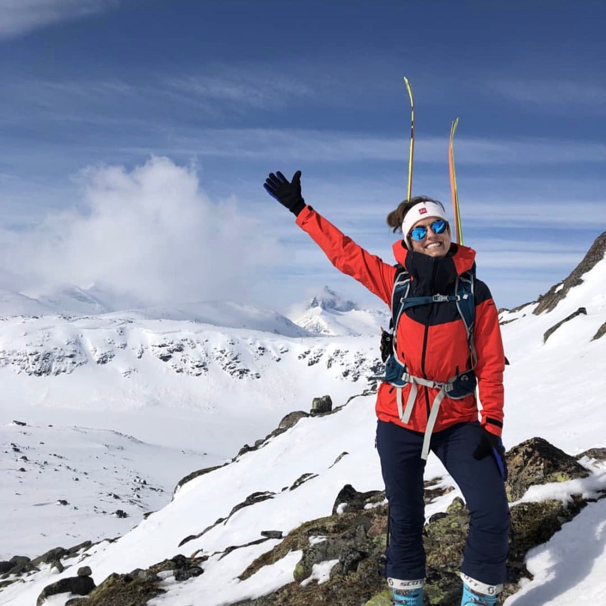 Katrine Sørum Randonee skiing in the mountains in good weather 