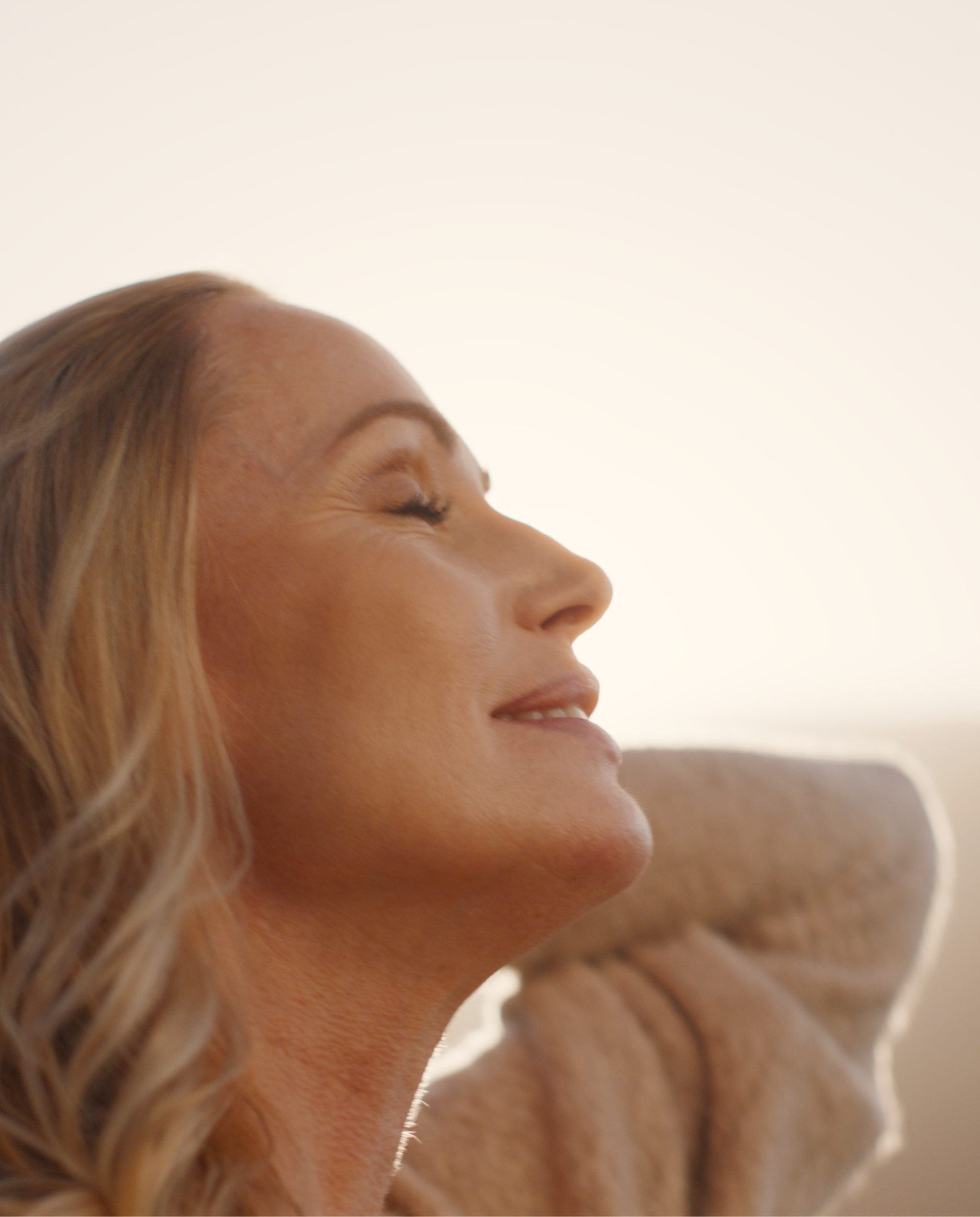 Womans face enjoying the sun