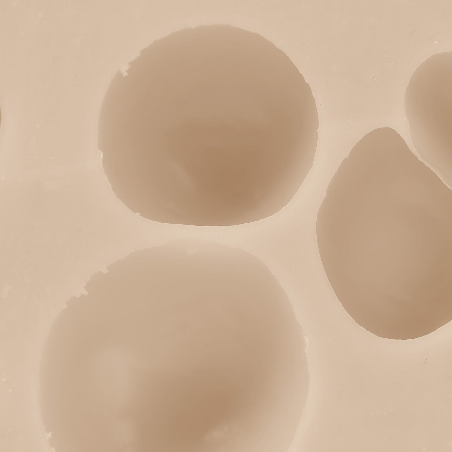 Close-up of beige spherical objects on a beige background