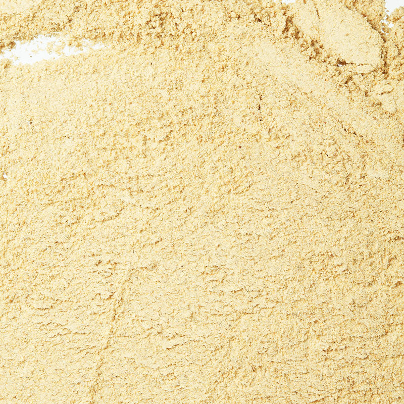 Close-up of beige sand with a slight texture
