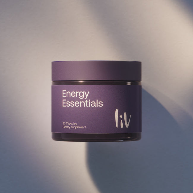 Purple container labeled 'Energy Essentials' by 'liv' on a gray background